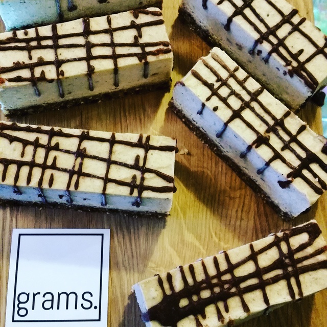 five large cakes on a wooden counter