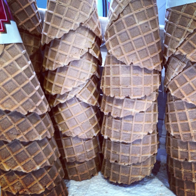 five stacks of upturned ice cream cones
