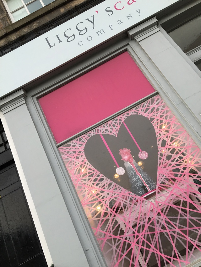 a heart shaped window display for a cake shop