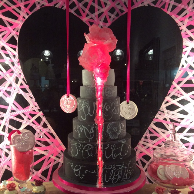 a large black six layered wedding cake