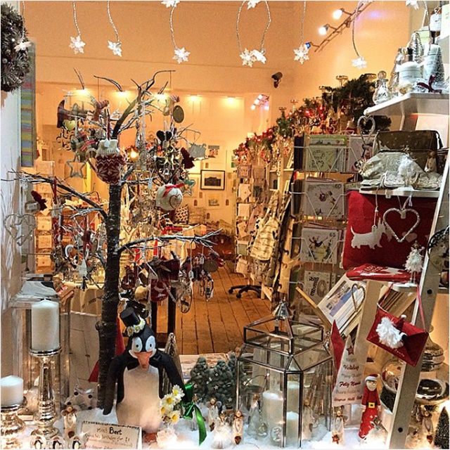 a Christmas display window for a gift shop
