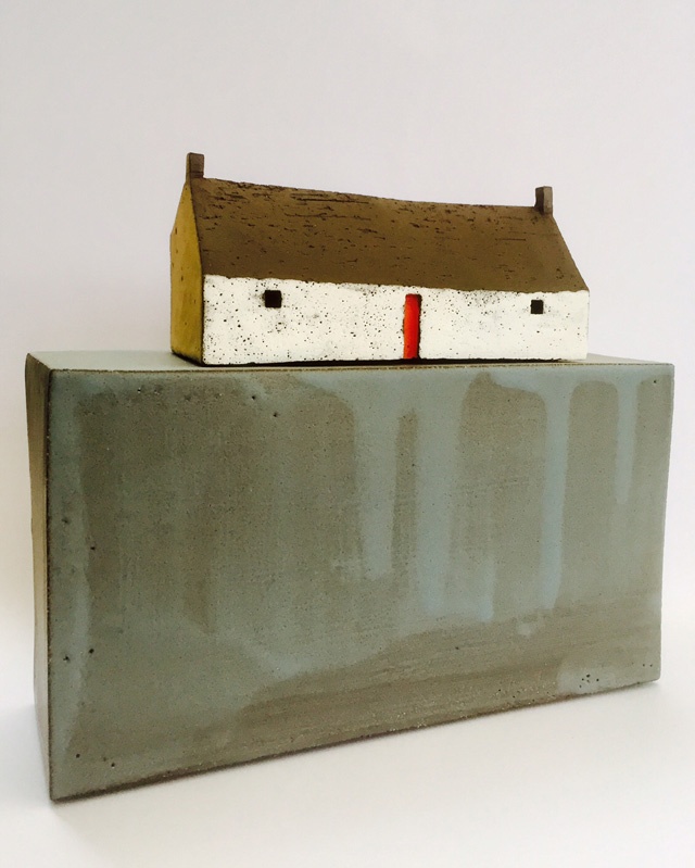 ceramic sculpture of a cottage