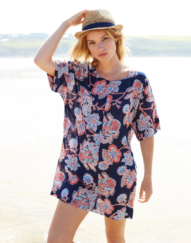 a slim blonde female fashion model at the beach for Nomads at Eden