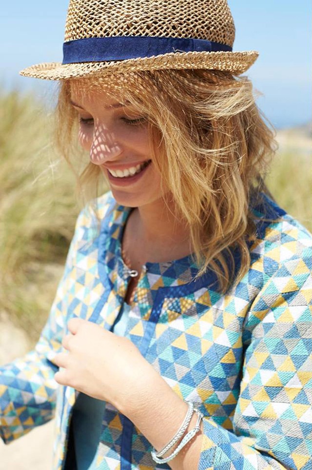 a slim blonde female fashion model at the beach for Nomads at Eden