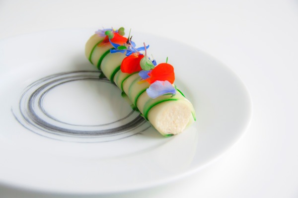 hot smoked salmon mousse and cucumber on a round white plate