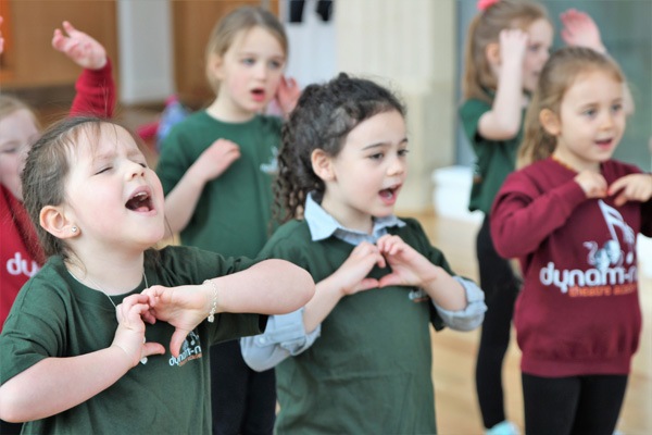children singing at musical theatre
