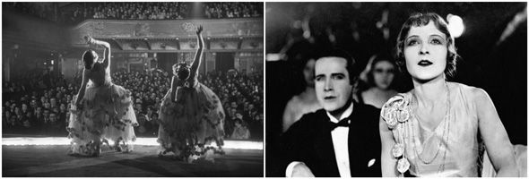 a silent film still of a man and woman in formal wear sitting watching performers on stage